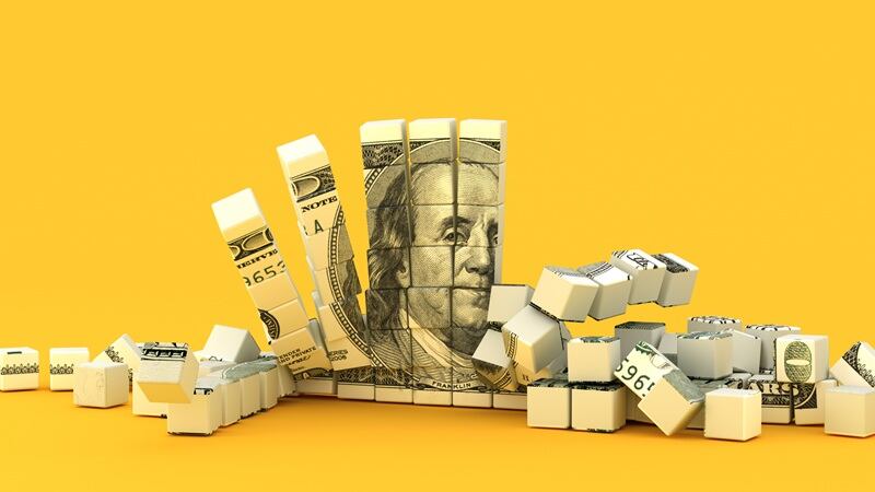Dollar bill crumbling.