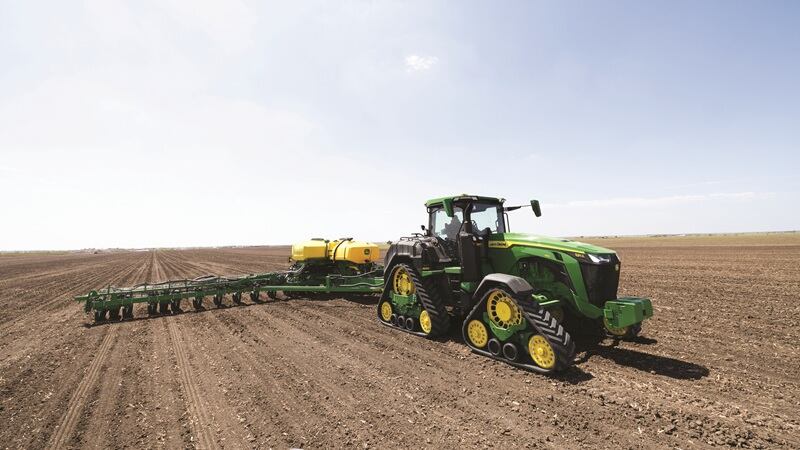 John Deere 8 Series tractor in a field.