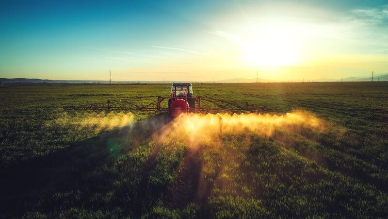 A tractor spraying